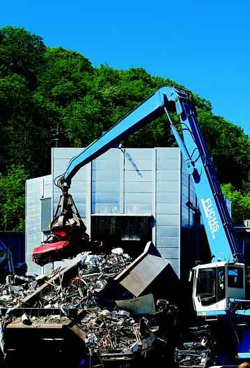 A powerful electromagnet picking up scrap metal